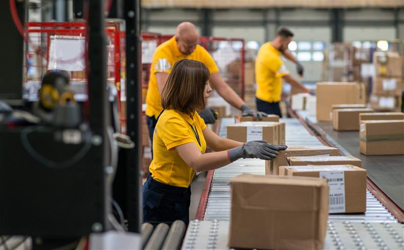 Factory workers packing boxes