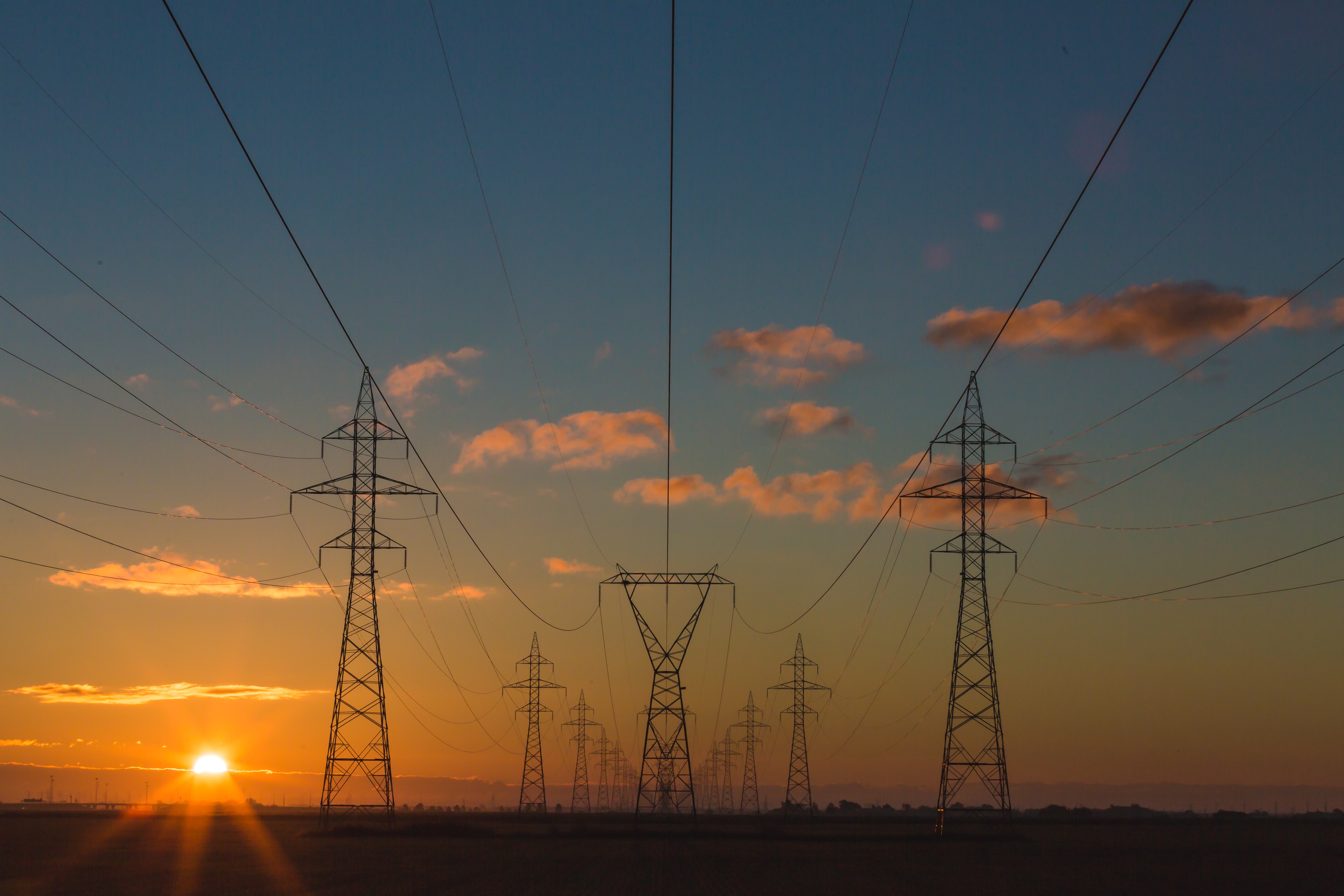 image showing electricity pylons at sunset