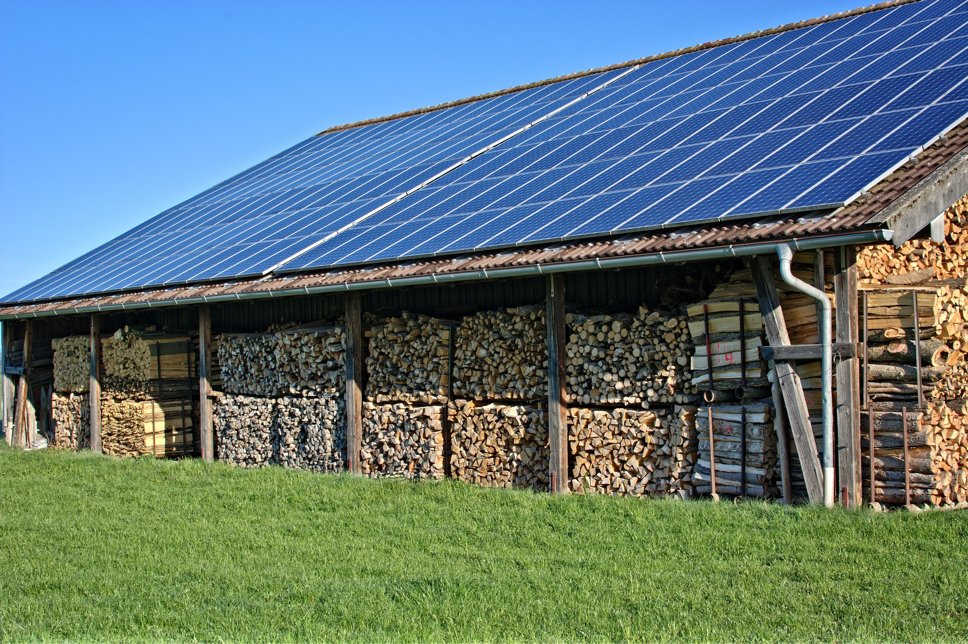 solar panels on roof of large wood shed