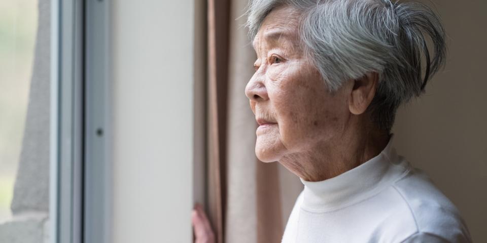 Elderly lady looking out
