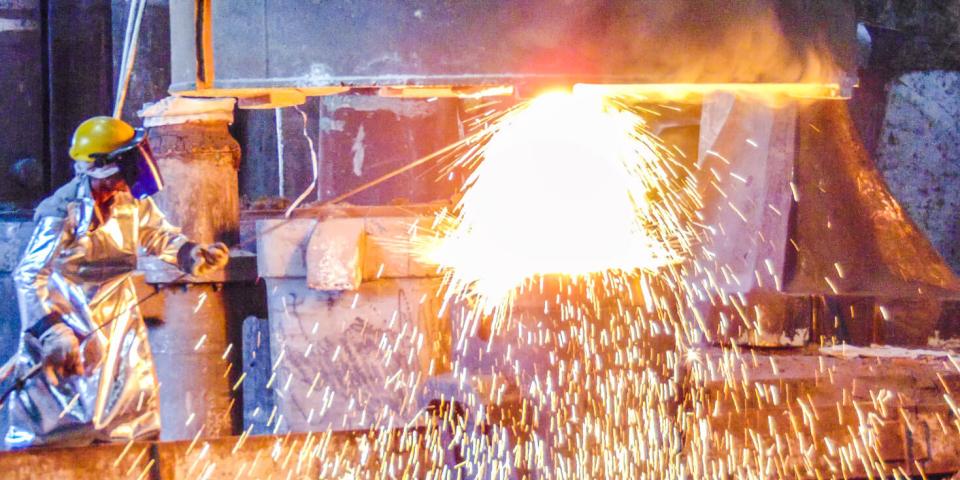 Figure welding metal with huge sparks