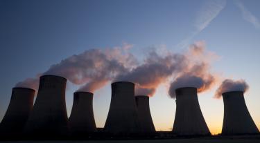 Coal plant chimneys emitting smoke 