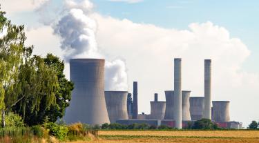 Photo of nuclear power plant chimneys from a distance
