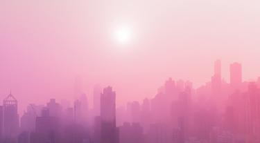 pink misty city skyline with buildings